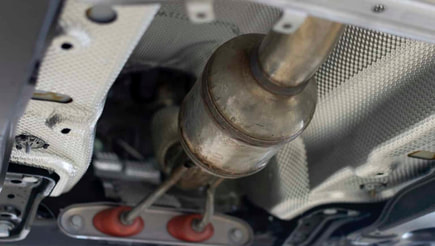 Where is the catalytic converter located?
